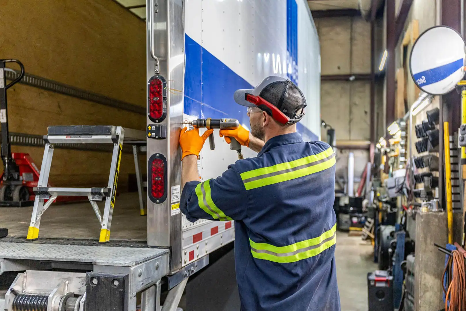 Technician replacing truck LED lighting