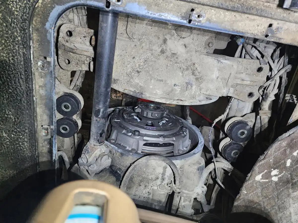 Technician working on truck transmission